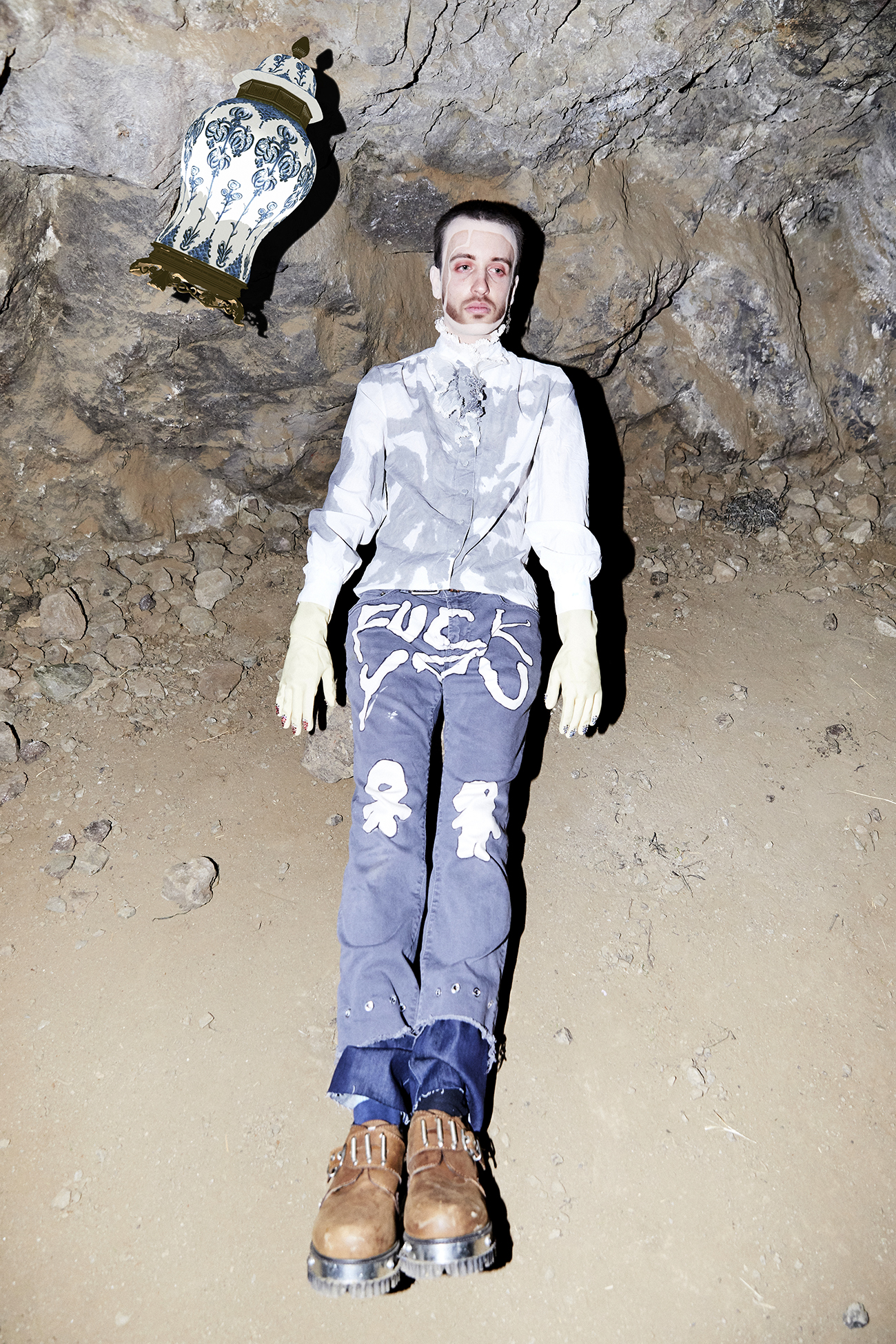 Full body shot of Jesse levitating in a cave